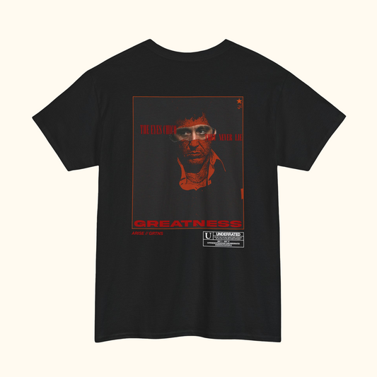 Black t-shirt with a graphic design on the back featuring scarface and the iconic quote "The Eyes chico they never lie"